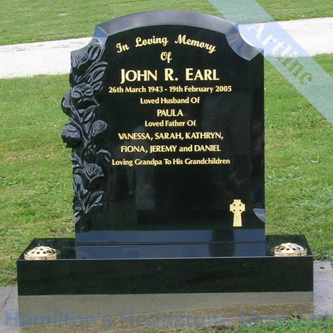 black headstone with gold lettering